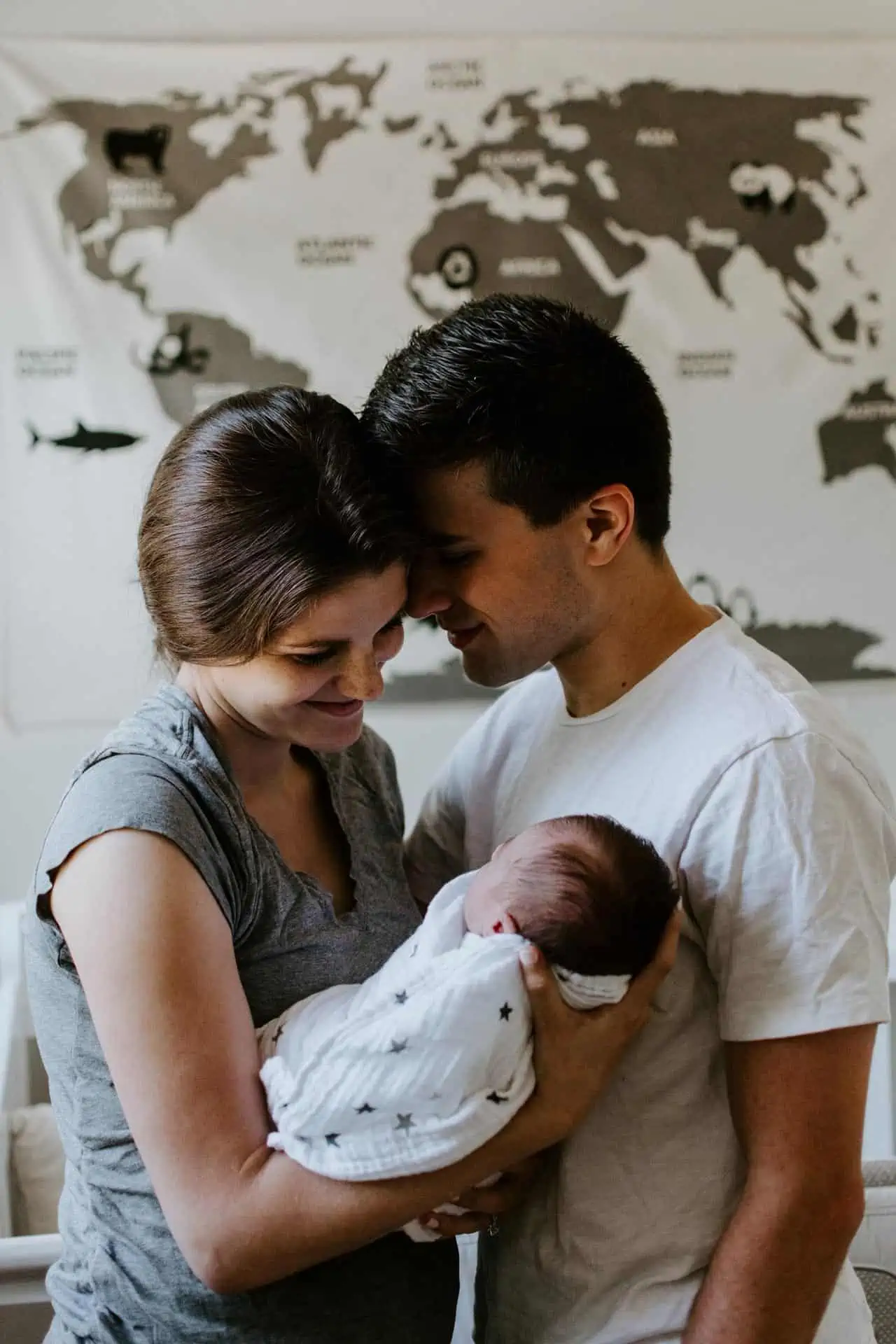 couple holding newborn baby