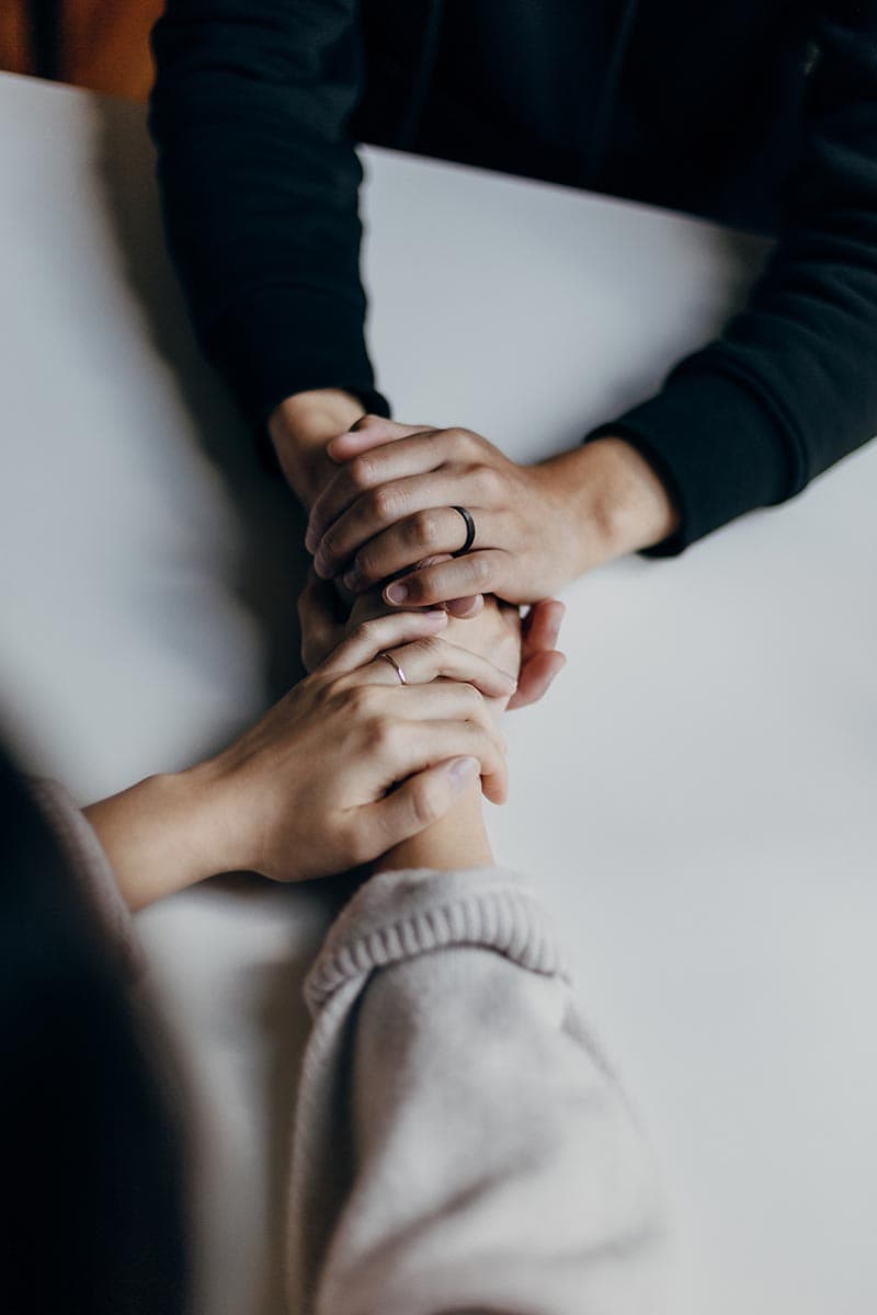 therapy support holding hands